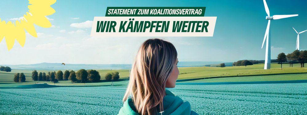 Wir kämpfen weiter (Blick auf grüne Landschaften mit Windrädern im Hintergrund)